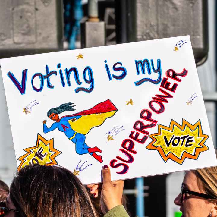 Picture of a protest sign that reads "voting is my superpower"